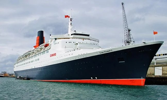 Queen Elizabeth 2 at sea, representing James Viscardini's commercial engineering experience with Cunard